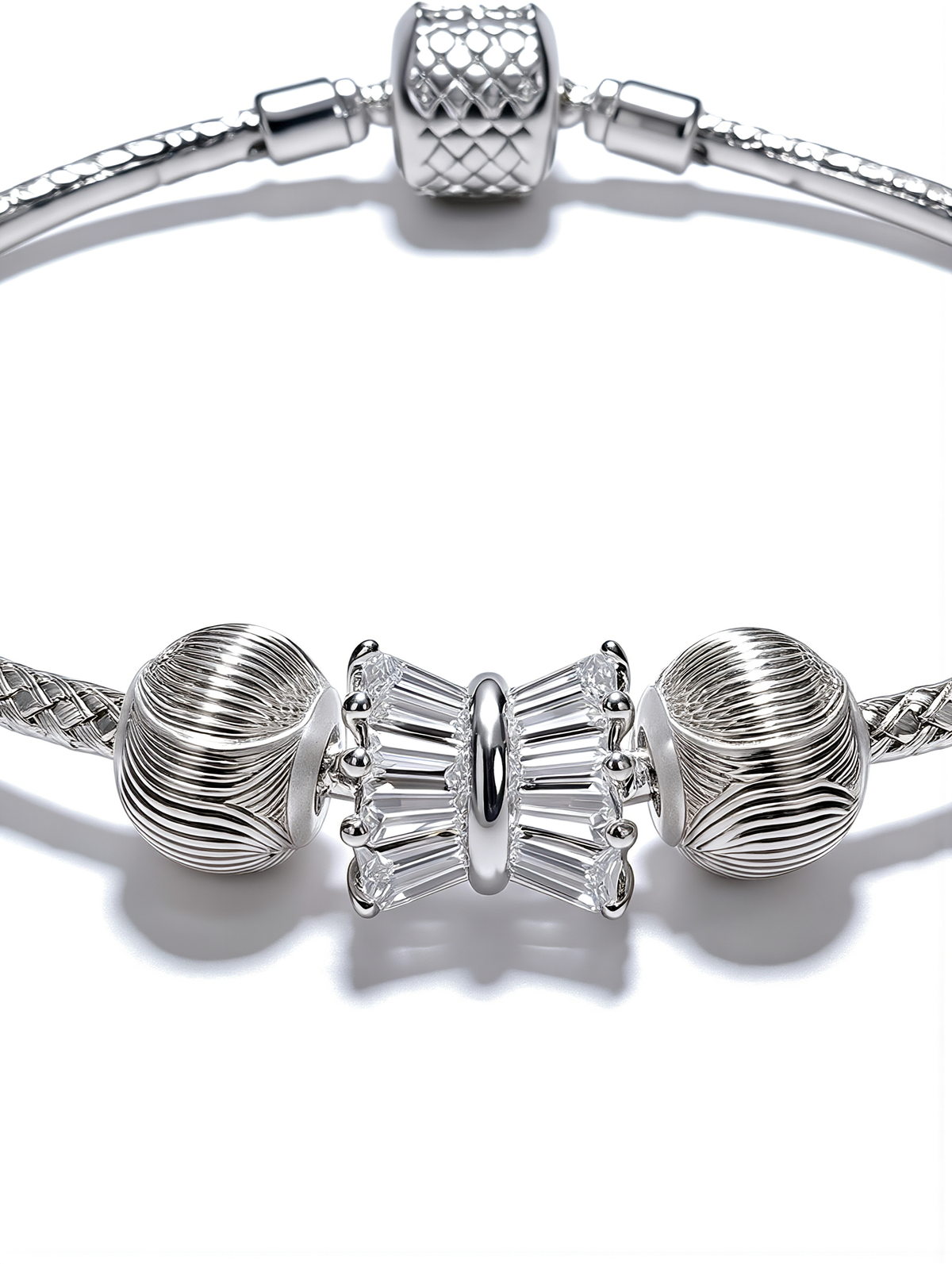 Élodie Bow Bracelet featuring intricate textured detailing and a crystal centerpiece for timeless elegance.